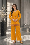 Mustard yellow embroidered cotton kurti with matching wide-leg trousers, floral embroidery and scalloped hem